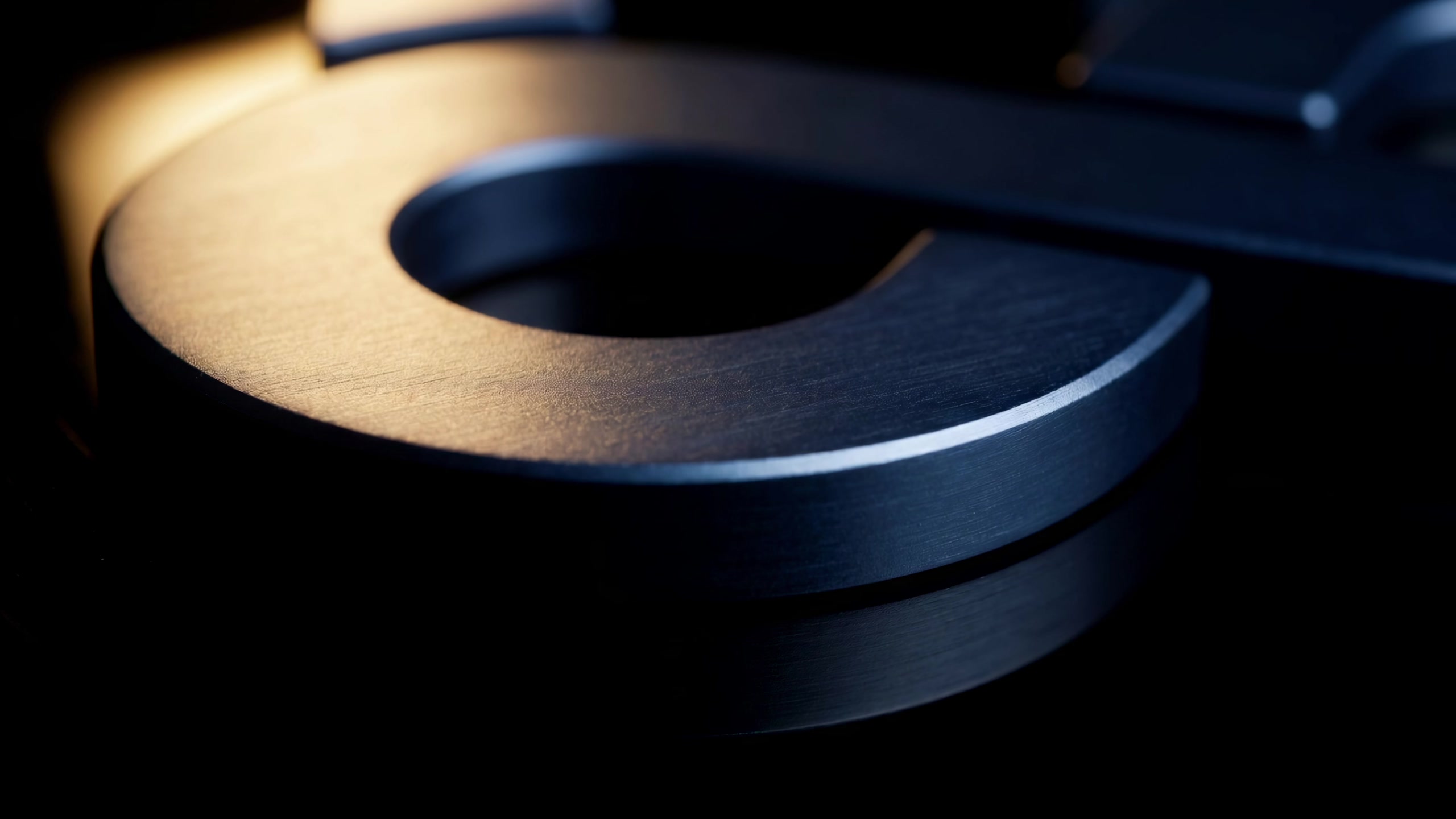 Close-up of the brushed-metal Aresiant logo mark